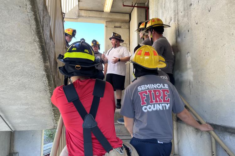 SCFD Lieutenant Patrick Criswell (center) trains Seminole County Fire Department recruits last week. 