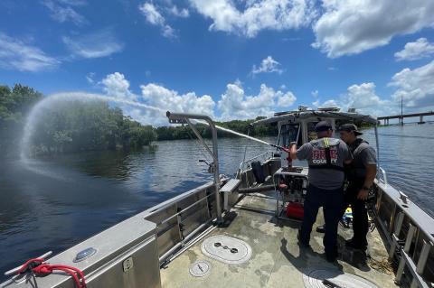Members of the Seminole County Fire Department demonstrate how they would put out fires on the river (above, below). This past week was Boater Safety Week, reminding everyone to stay safe on the water. 