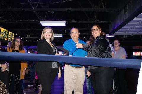 Airport Lanes held a ribbon-cutting ceremony for their reopening with Airport Lanes General Manager Dianna Nairn (left), Sanford Mayor Art Woodruff, and Aloma Bowling Centers COO Jennifer Halpern.