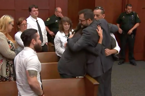 Grant Amato's brother Jason Amato hugs Assistant State Attorney Domenick Leo after the verdict is read. Grant's former friend, Jericho Fine, stands in the foreground. 