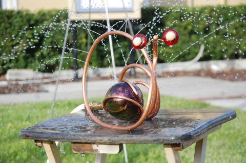 Jim Cook, a vendor from Michigan, sold sprinklers like this snail at the annual Longwood Arts and Crafts Festival over the weekend.