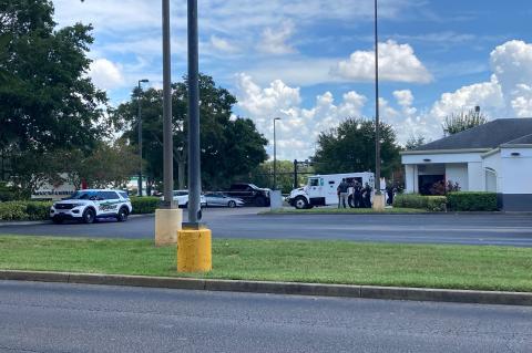 Seminole County Sheriff’s Office deputies surround the Bank of America on Thursday after a Loomis armored truck was robbed.