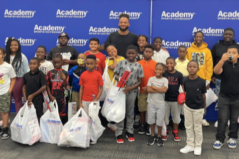 NFL Player Gabriel Davis (center) shops with kids at Academy Sports in Lake Mary on Friday.