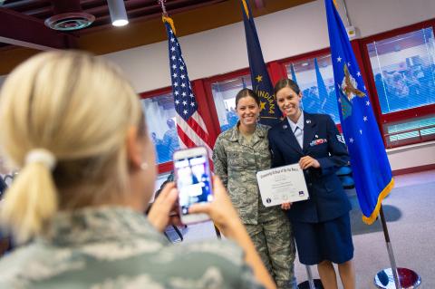U.S. Air Force Staff Sgt. Kelsey Sever (right), an aerospace medical service technician assigned to the 181st Intelligence Wing, Indiana Air National Guard, poses for a photo with her sister, U.S. Air Force Tech. Sgt. Caitlan Kotowski.. 