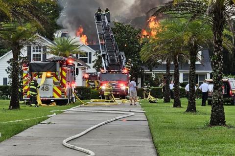 Units from Seminole County Fire Department, Orange County Fire Rescue Department and Oviedo Fire Department responded to the house fire on Lake Mills Road on Monday afternoon (above).