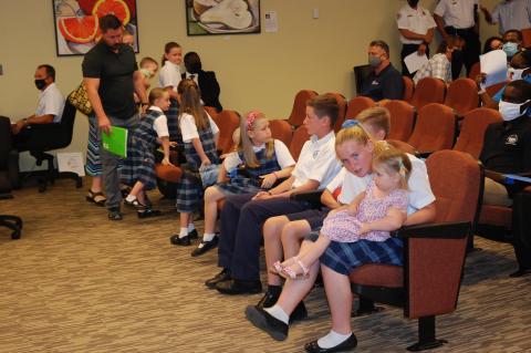 Richard Campbell and his 10 children attended the commission meeting to oppose the Monroe Place development on W. 1st Street. 