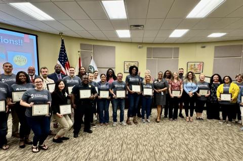 Citizens Academy Class 20 students (above) celebrate their graduation with city officials at Monday’s commission meeting in City Hall. 