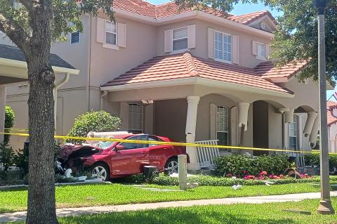 The Oviedo driver crashed his Toyota Camry (above) through a front porch before finally coming to a stop.