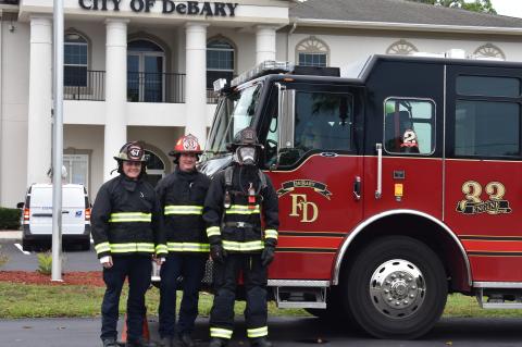 Firefighters in full gear received as part of the grant.