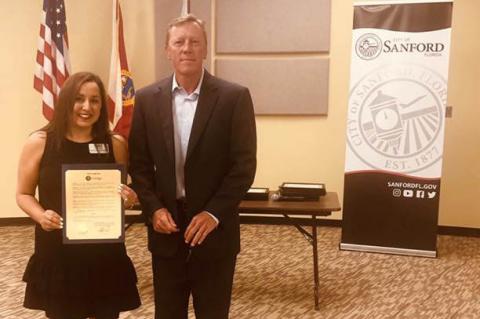 Bianca Sabrkhani, Director of Development and Communication with the Victim Service Center of Central Florida, with Mayor Jeff Triplett at a recent City Commission meeting, where April 24 was declared as Denim Day in Sanford officially.