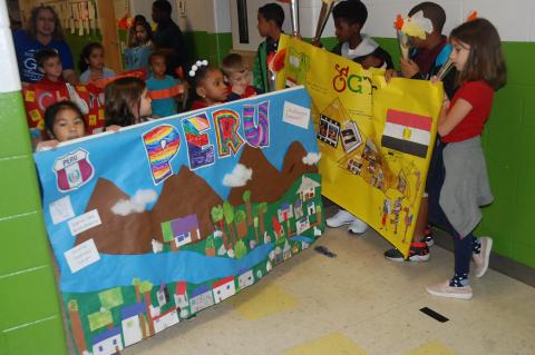 Students at Wicklow Elementary hold their posters (above, below) representing different countries for the Peace Run. 