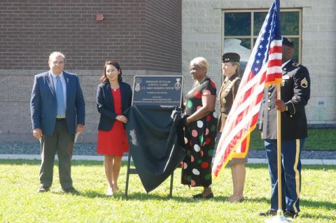 Sanford Mayor Art Woodruff, left, U.S. Rep. Stephanie Murphy, Kasinal Cashe-White and Maj. Get. Jamelle C. Shawley unveiled the plaque that will mark Friday's dedication of the Sergeant First Class Alwyn C. Cashe U.S. Army Reserve Center, 3566 Skyway Drive, Sanford.