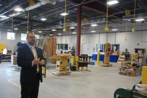 Lyman Principal Michael Hunter shows off classrooms for welding and HVAC as well as building construction instruction.