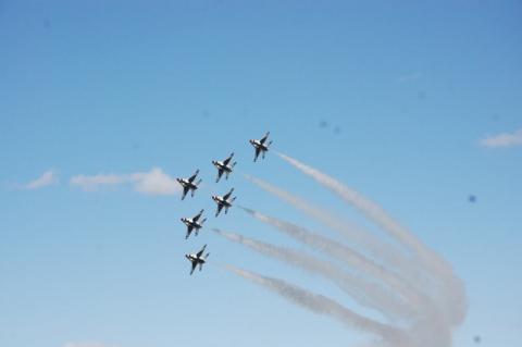 U.S. Air Force Thunderbirds Delta formation turns left in front of a crowd of thousands on Sunday.