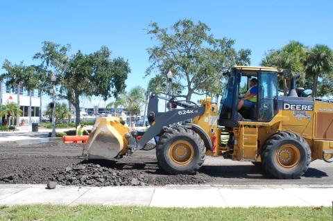 City of Sanford crews first paved a way to Marina Island (left) following the hurricane. However, due to rising waters, crews had to return a second time (right) to redo their work on Palmetto Avenue.