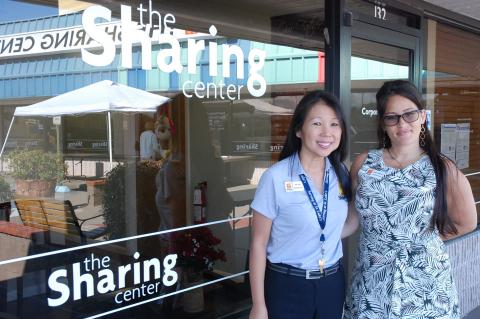 Nina Yon, left, president and CEO of The Sharing Center, poses Monday with Jessica DeNichilo, the Center’s administrative assistant.