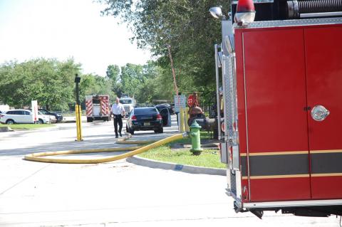 Sanford Fire Chief Craig Radzak walks out of the Resolute Tissue company on St. Johns Parkway Monday afternoon.