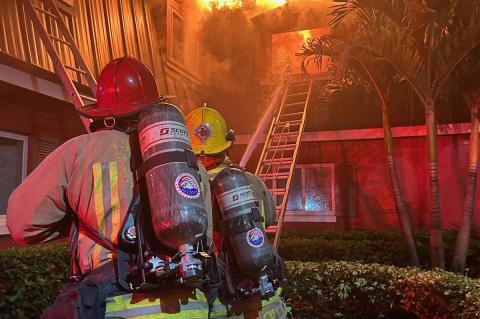 Crews battle the 2-alarm fire (below) at the Sapphire Winter Park Apartments Tuesday morning. Several units were forced to evacuate following the fire (above). The fire remains under investigation, but was believed to be caused by an unattended candle.