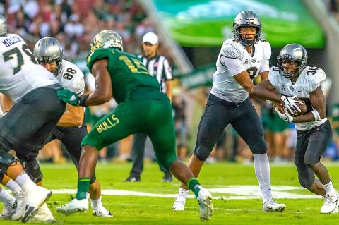  Herald photo by Greg Fencik  Darriel Mack Jr. (No. 8) and Greg McCrae (No. 30) will look to lead the UCF football team to its second straight AAC Championship today (Saturday) at Spectrum Stadium.