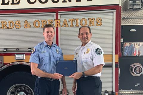 Firefighter/Paramedic Brad Dickey (left) with Seminole County Fire Chief Otto Drozd III.