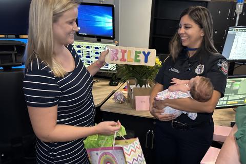 Mother Victoria Burke with Dispatcher Nora Acuna and Baby Riley. 
