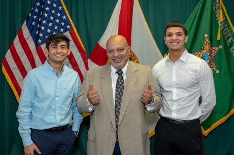 Executive Director of Future Dreamers & Achievers Bobby Rivera (center) with winners Santiago Parra-Alvarez (left) and Hector Cruz.