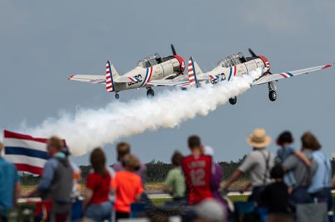 There is a team of 10 pilots that fly the six Geico Skytypers during air shows. 