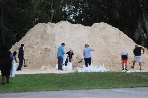 Seminole County residents collect sandbags this week in preparation for Hurricane Ian, which is expected to make landfall on the west coast of Florida. 