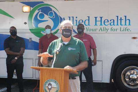 Mayor Art Woodruff (above) speaks at the grand opening of the Allied Health clinic. 