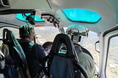 Gov. DeSantis takes a tour in the Alert 2 helicopter to survey damage.
