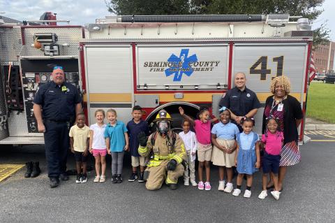 Children from Midway Elementary learn about fire safety from members of the Seminole County Fire Department. 