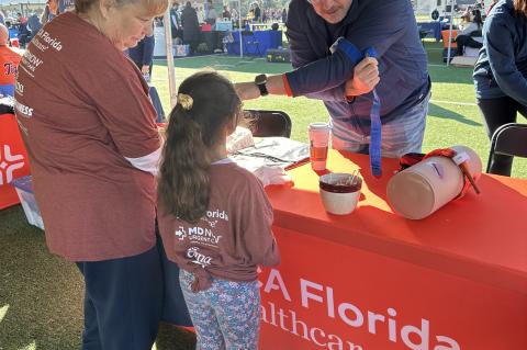 Rick Ricardi, Trauma Director at HCA Florida Lake Monroe Hospital, taught lifesaving Stop The Bleed skills to Seminole County Public Schools employees and family members at the 2024 Strolling With Serita 5K and Wellness Fair.