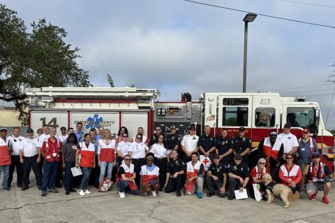 Seminole County Fire Department personnel, volunteers and members of the American Red Cross gather for the smoke alarm blitz in the Eastbrook Subdivision earlier this month.