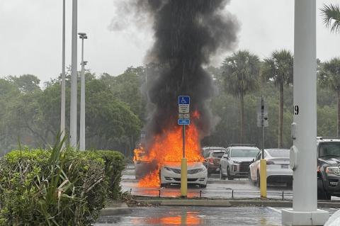 The vehicle was engulfed in flames when the Oviedo Fire Department arrived to the mall on Friday.