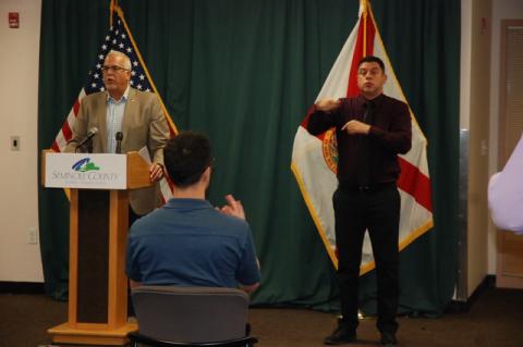 Adam Ledo (left) and Andres Velandia (right) work as a team to interpret Seminole County’s press conferences for the Deaf. Velandia, who is Deaf, translates the conferences into a more gestural language, so it can be broadly understood. 
