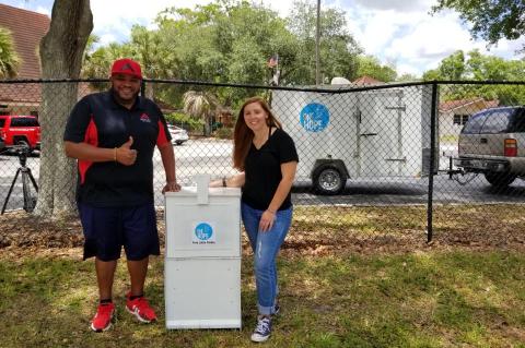 Action Church Pastor Kenneth Clark (left) with One Hope Founder Angeley Ford and one of the Free Little Pantries.  