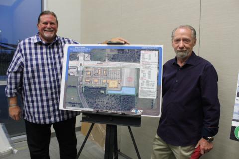 Manager Keith Lawes (left) and Jim Dunn King celebrate the advancement of their new grocery store complex, coming within the next year to State Road 46 heading toward Geneva.