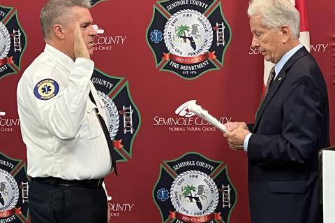 Fire Chief Matt Kinley (left) is sworn-in by Founding Fire Chief Gary Kaiser. 
