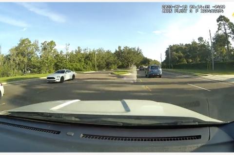 Sheriff Dennis Lemma’s son, Dylan, is seen on a dash camera (above) speeding in unincorporated Winter Springs this week.
