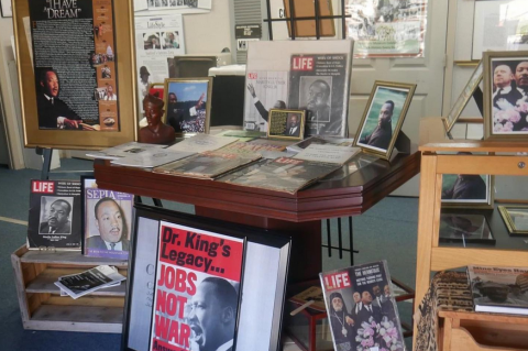 An exhibit at the Goldsboro Museum, The Dream of Justice Lives On, displays news clippings about Martin Luther King. Jr.