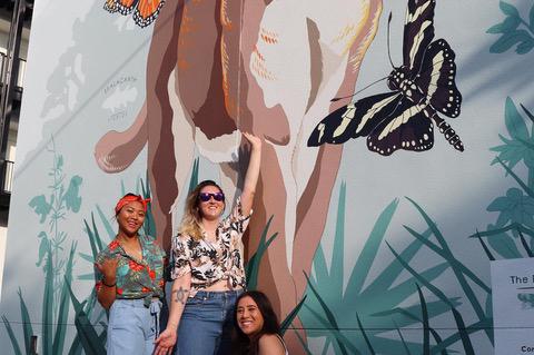 From left, Jessica Soriano, mural designer Deanna Derosia and Amy Koehler.