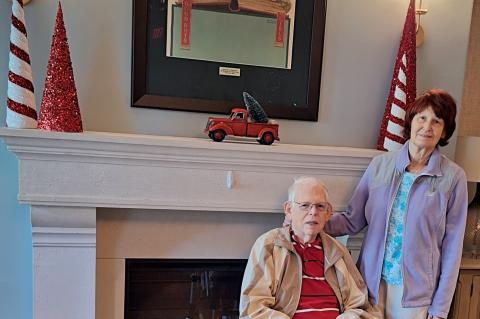 Marshall Stolz, 86, (left) and his wife Eileen (right) show off the Norman Rockwell print he donated to The Watermark.