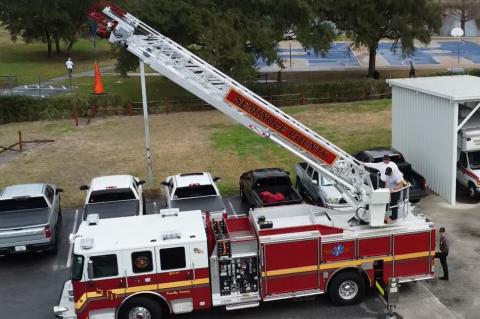 The ‘wet-down’ (above) is performed by a fire house as part of the Quint 24 (top) being placed into service. 