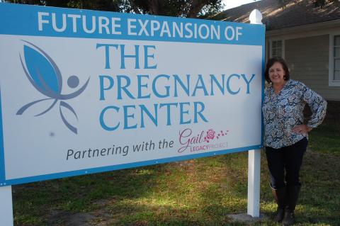 Andrea Krazeise, founder and executive director of The Pregnancy Center, stands on the organization’s new property on which it will expand services for pregnant women in crisis.