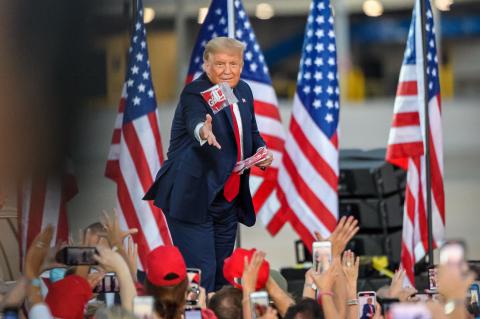 Herald photos by Romeo Guzman/ President Donald J. Trump arrived at the Orlando Sanford International Airport Monday evening for a presidential campaign rally. Trump came after he recently recovered from the Coronavirus and he threw masks to the crowd.