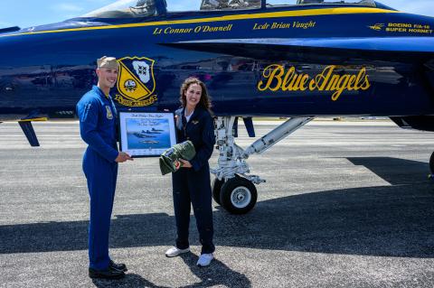 Lt. Connor O’Donnell (left) with Teacher Janan Hodges (right) after her flight with the Blue Angels earlier this week.