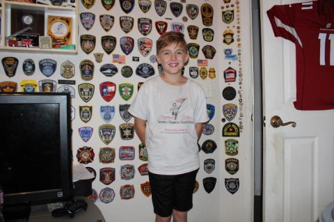 Zechariah Creighton, 10, is known for running a mile in tribute to each fallen officer or first responder he learns about.