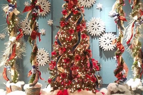 Sanford Flower Shop’s window displays (above) have been a holiday favorite in downtown Sanford. 