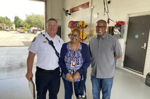 Lt. Matthew Rothfuss (left) with Janie Pettaway and Robert Pettaway, Janie Pettaway was saved by members of the Oviedo Fire Rescue and Seminole County Fire Department on July 21.