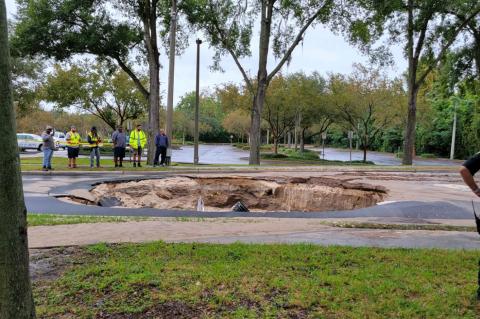 Crews look at the damage caused by a water main break last week at the Seminole State College Altamonte Springs Campus. 